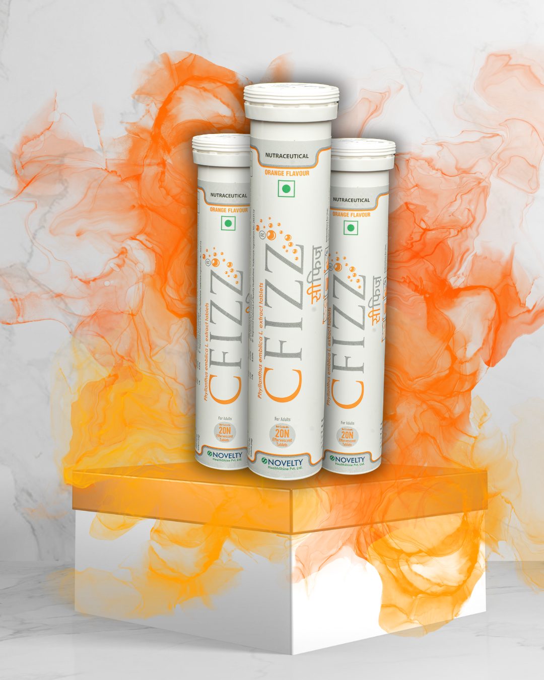 Three Cfizz tubes on a decorative stand with an orange and white abstract design in the background.